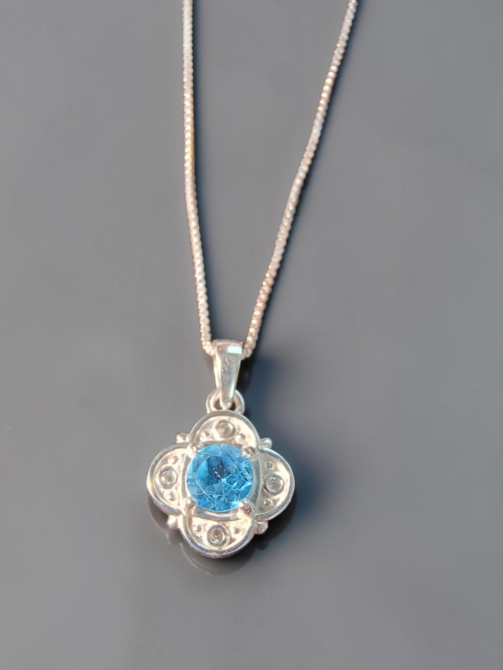 Blue Topaz Gemstone Floral Pendant Necklace In Sterling Silver